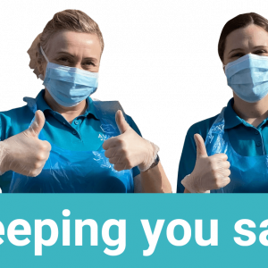 Avanti Homecare staff demonstrating the PPE, including Aprons masks and gloves they are wearing to keep people safe.