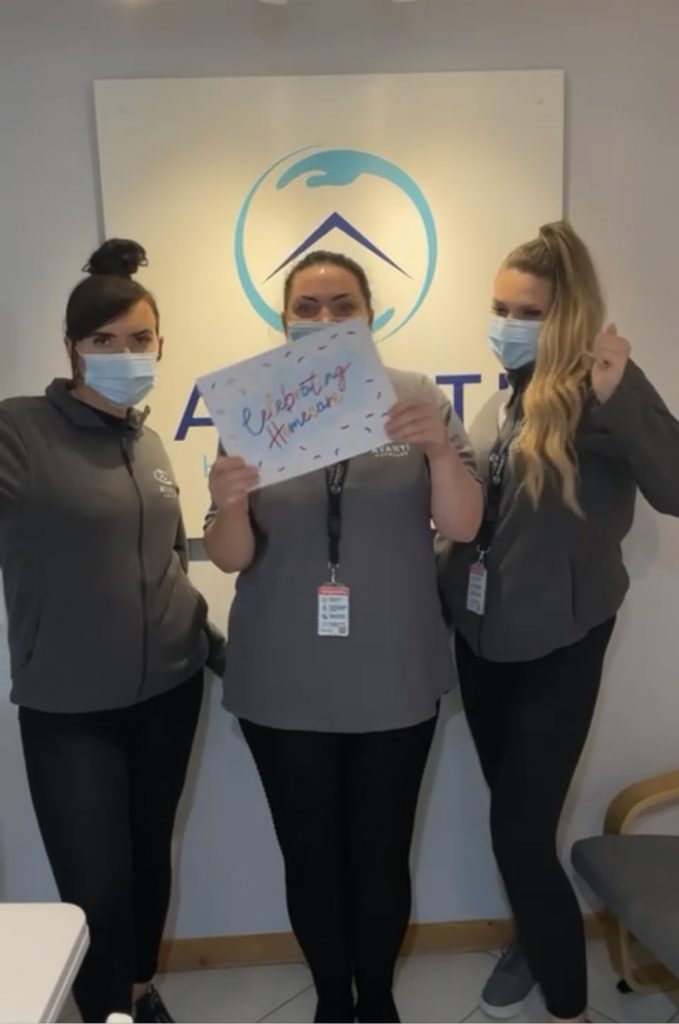 A few from our Ilkeston branch team holding a Celebrating Homecare sign